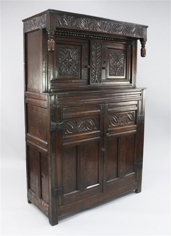 A 17th century carved oak court cupboard, W.3ft 9in.